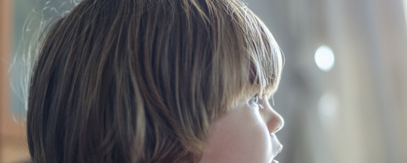 small boy watching tv photo